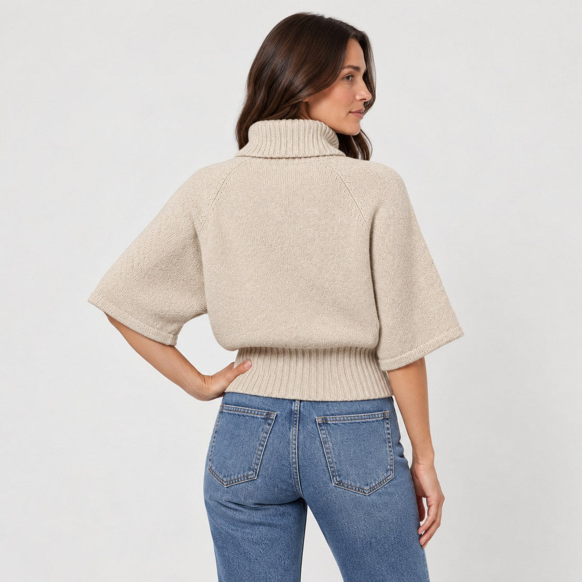 Women's cable knit turtleneck with cape sleeves in Beige | Grinton – back view