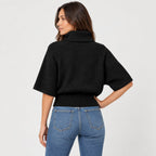 Women's cable knit turtleneck with cape sleeves in Black | Grinton – back view