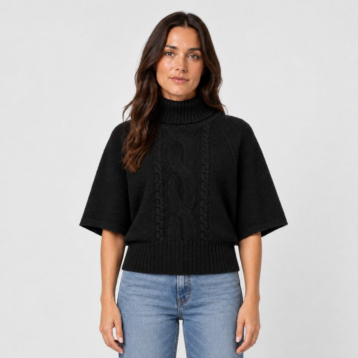 Women's cable knit turtleneck with cape sleeves in Black | Grinton – front view