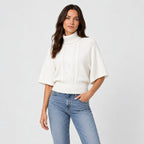 Women's cable knit turtleneck with cape sleeves in White | Grinton – side view