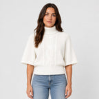 Women's cable knit turtleneck with cape sleeves in White | Grinton – front view
