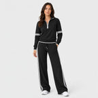 Women's quarter-zip and wide-leg trouser set in Black | Dorstone – front view